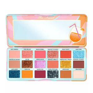 Too Faced Eye Shadow Palette features 18 shades, including a mix of matte, shimmer, and glitter finishes with names like \“Holy Cannoli,\“ \“Lake Como,\“ and \“Espresso Yourself.\“ The palette has a colorful design with a mirror inside.