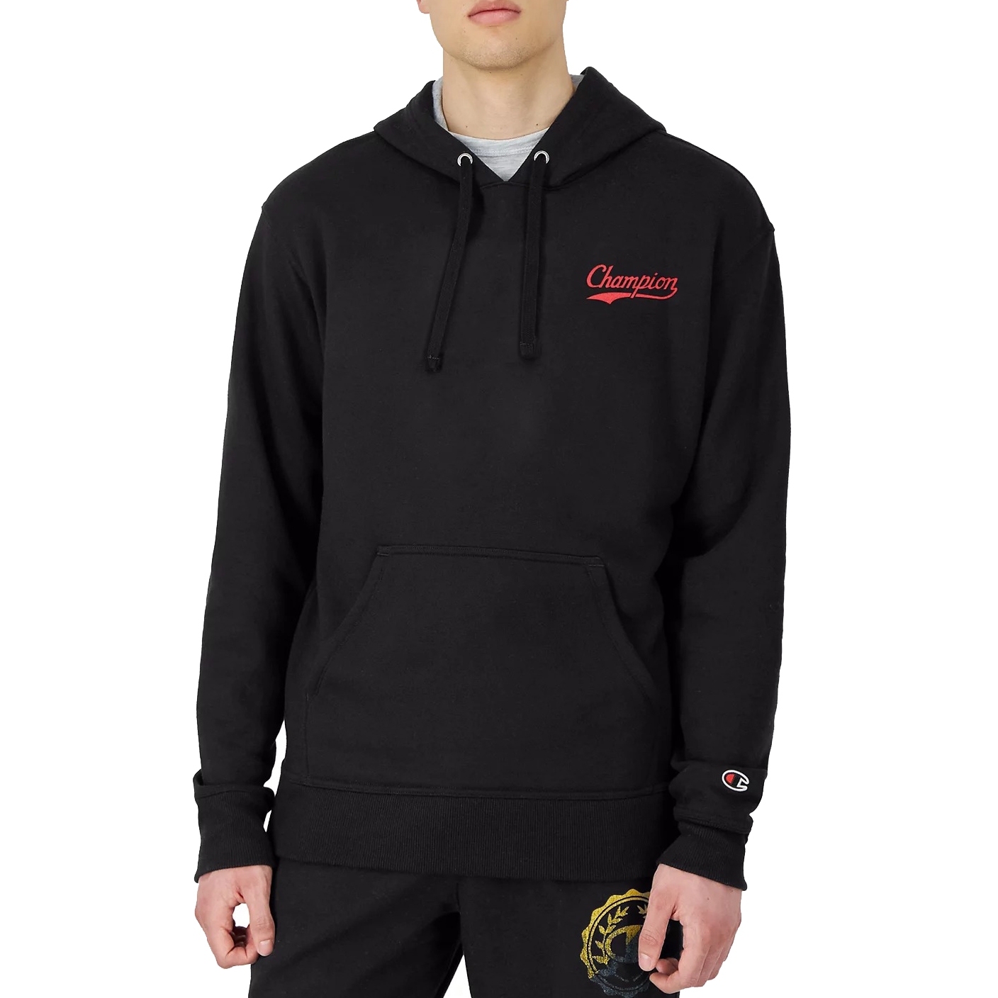 A black Champion hoodie with a red logo on the chest and a small logo on the sleeve. It features a drawstring hood and a front kangaroo pocket.