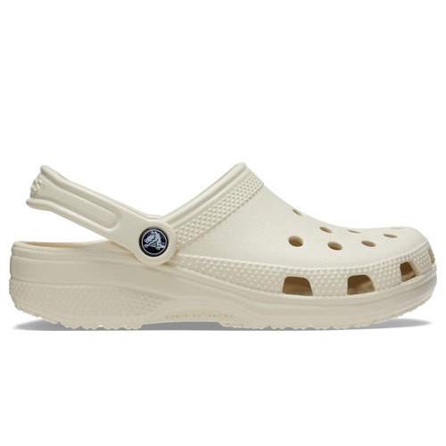 Ivory-colored Crocs Classic Clogs featuring a slip-on design with ventilation holes and an adjustable heel strap for comfort.