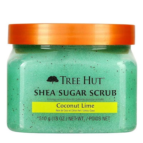 a green shea sugar scrub with an orange top