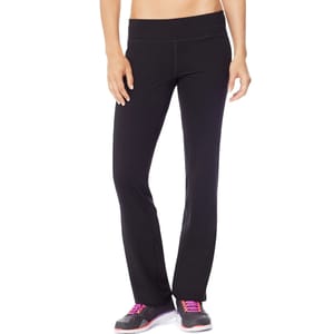Black yoga pants with a wide waistband, paired with black athletic shoes featuring pink laces and white soles.