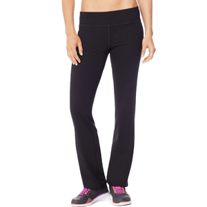 Black yoga pants with a wide waistband, paired with black athletic shoes featuring pink laces and white soles.