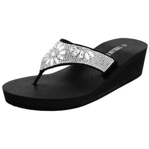 Women's black wedge sandals with a thong design, featuring embellished rhinestones and white decorative shapes on the strap for a stylish look.