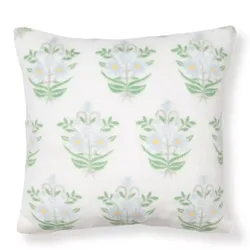 Square cushion featuring a floral pattern with green stems and light-colored flowers on a white background.