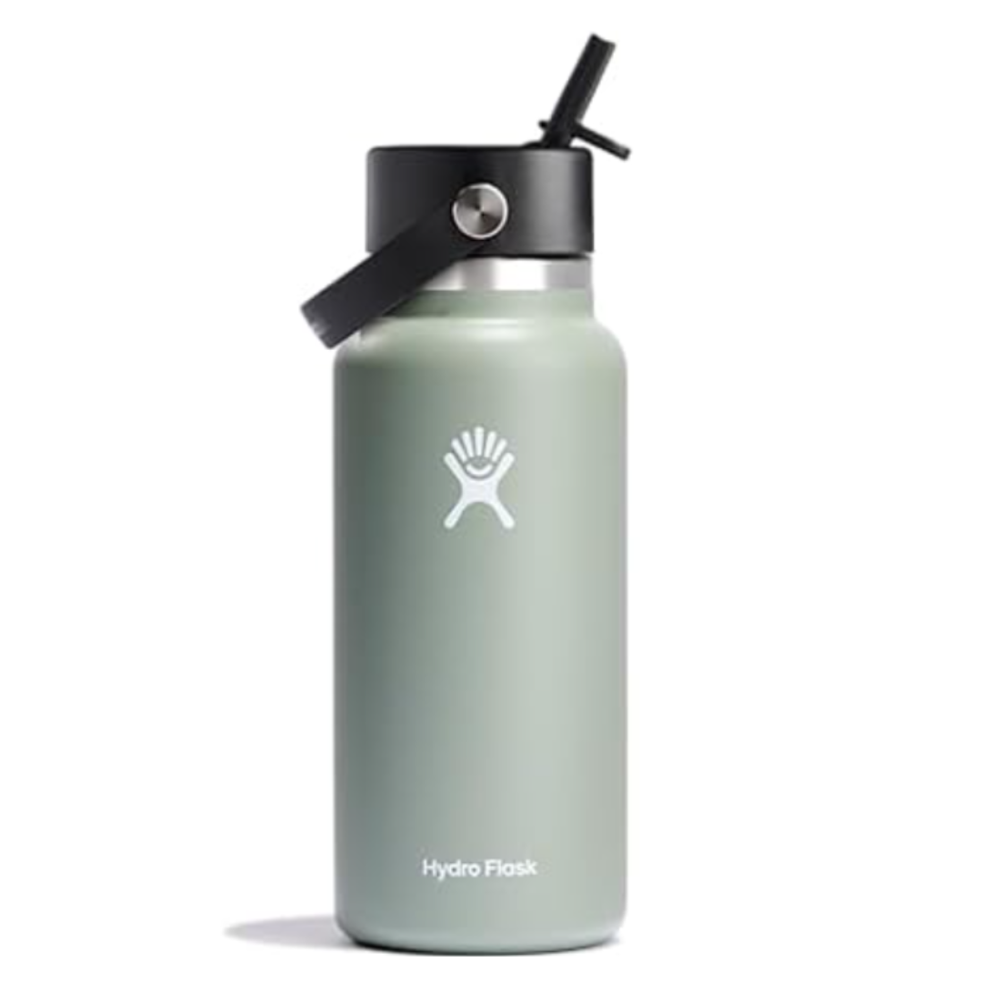 A Hydro Flask water bottle with a sage green finish, featuring a black straw lid and carrying handle.