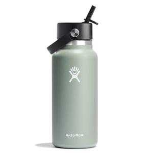 A Hydro Flask water bottle with a sage green finish, featuring a black straw lid and carrying handle.