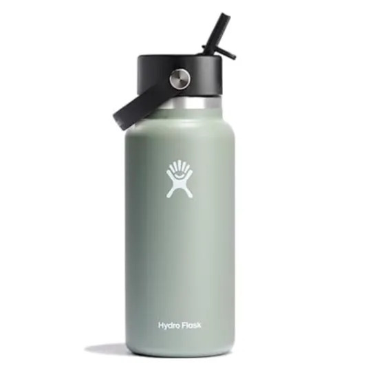 A Hydro Flask water bottle with a sage green finish, featuring a black straw lid and carrying handle.