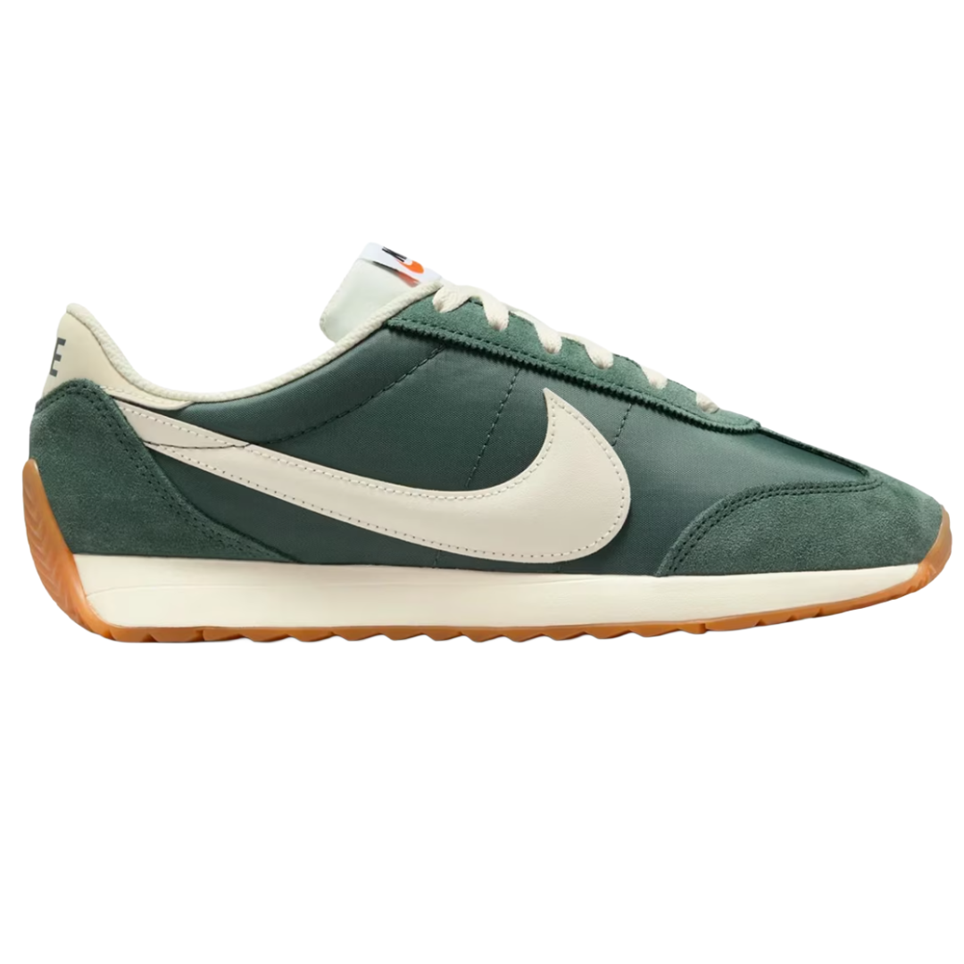 Dark green Nike sneaker with a white swoosh, beige accents, and a gum sole.