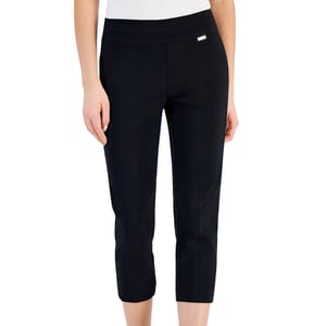 Black capri pants with a slim fit and a small decorative metal detail near the waistband, paired with a white top.