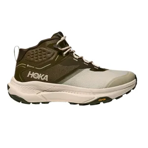 Hoka GORE-TEX trail hiking shoe featuring a rugged design with an olive green and cream color scheme, Vibram sole, and secure lace-up closure.