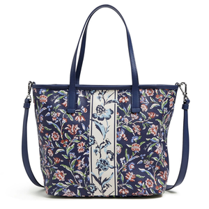 A floral patterned tote bag with dual handles, a detachable shoulder strap, and a central decorative stripe.
