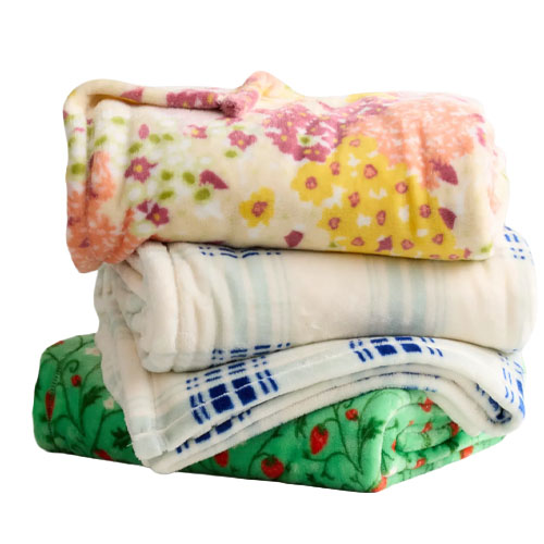 Stack of three folded blankets featuring floral and geometric patterns in assorted colors including pink, yellow, white, blue, and green.