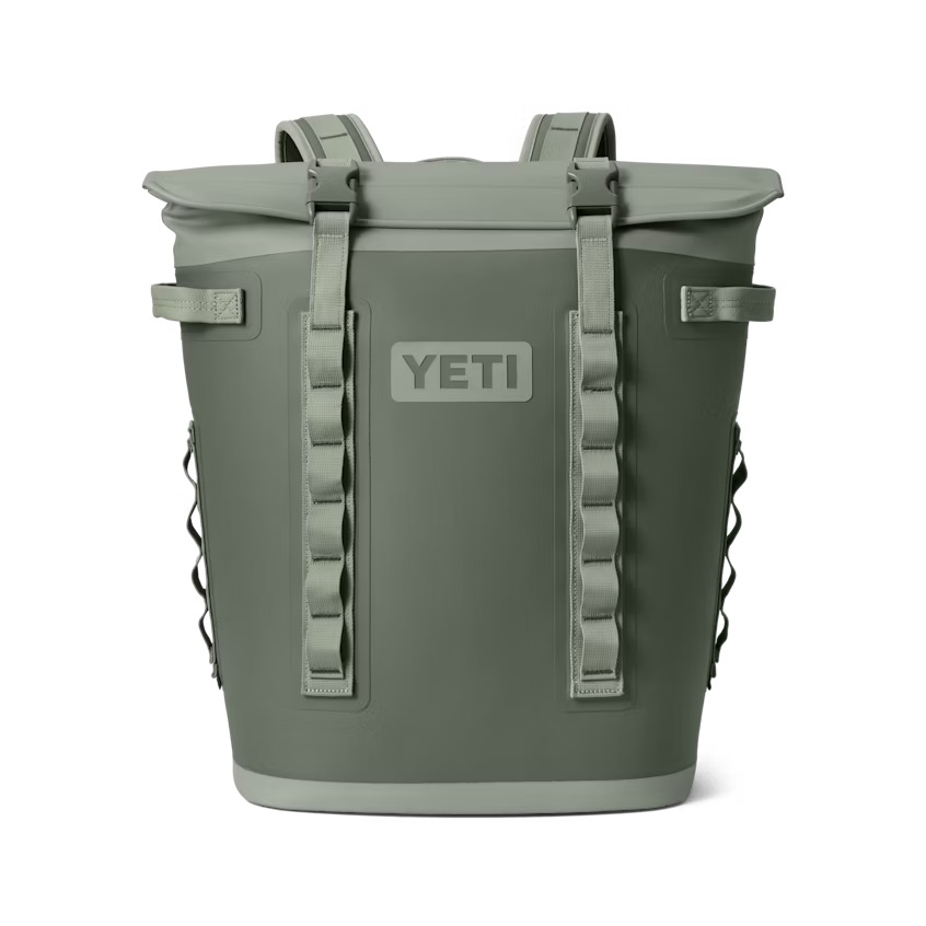 An olive green YETI brand cooler with heavy-duty straps and a logo on the front.