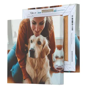 A canvas print showcasing a woman affectionately leaning over a Golden Retriever.