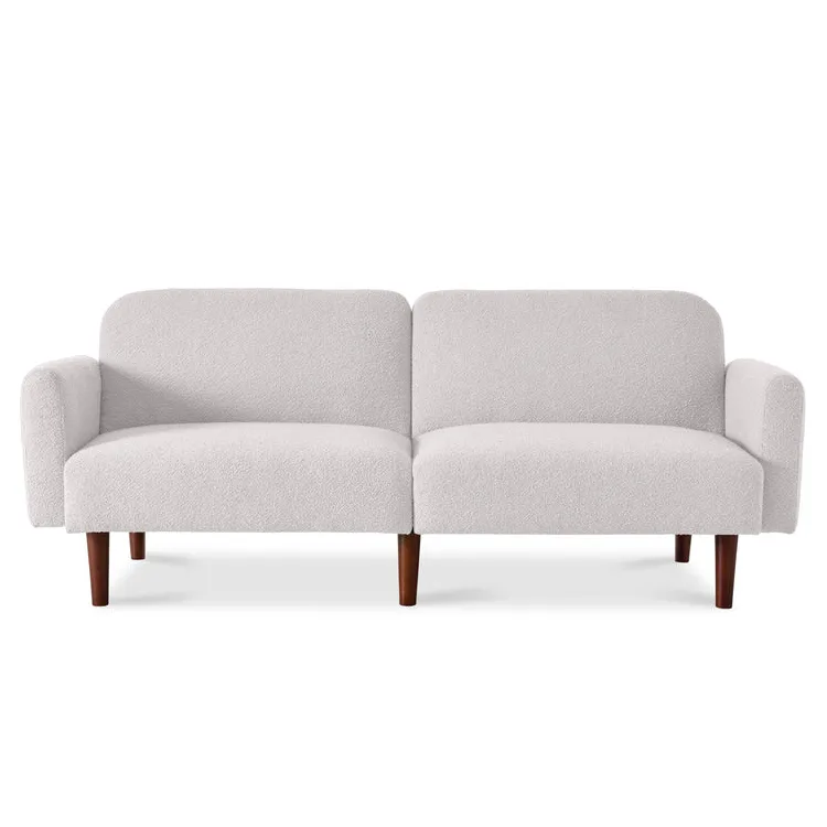 A minimalist white upholstered convertible futon sleeper bed with a split-back design, rounded armrests, and wooden legs.