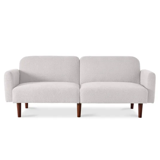 A minimalist white upholstered convertible futon sleeper bed with a split-back design, rounded armrests, and wooden legs.