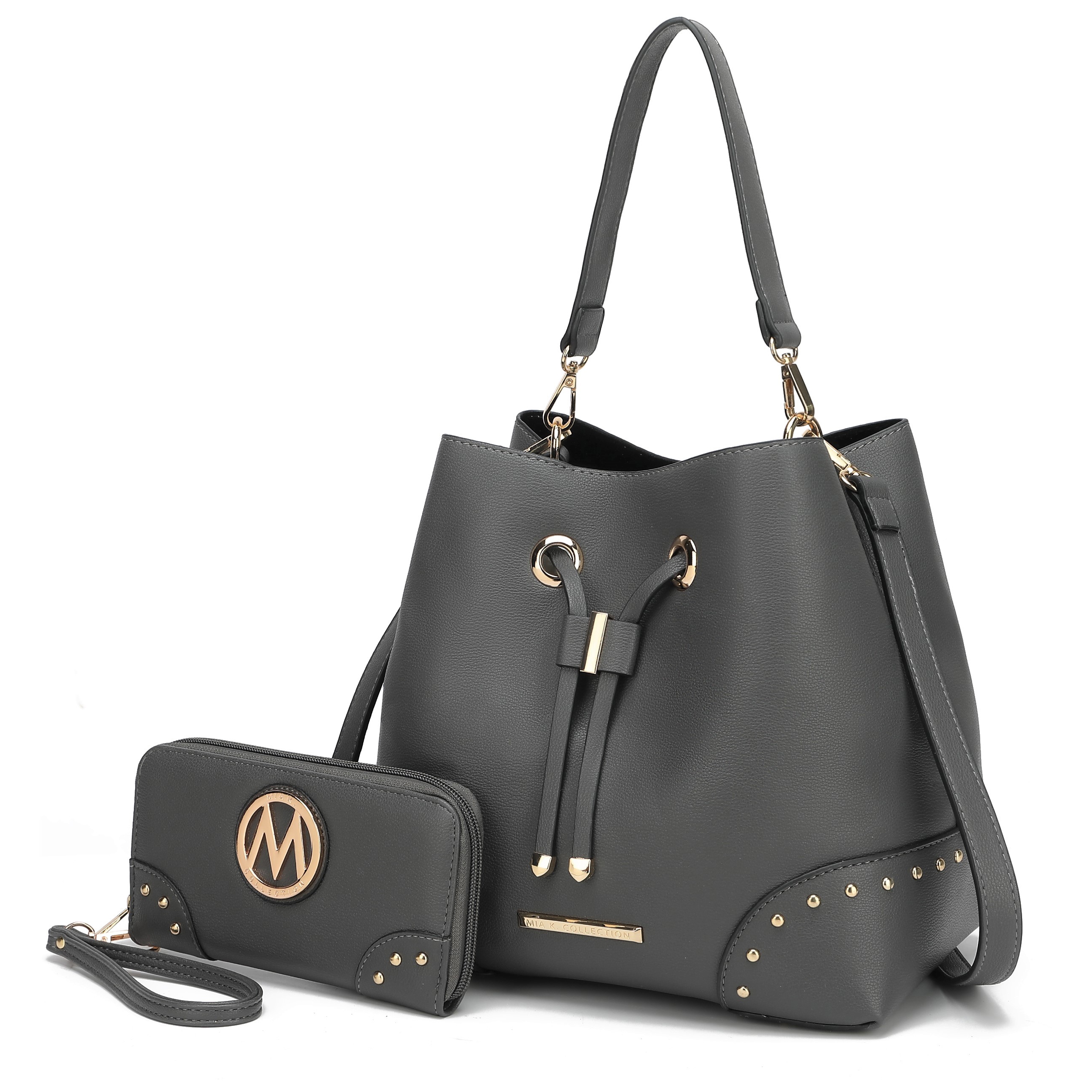 A gray bucket bag with gold hardware and a matching wallet featuring a circular emblem. Both items have decorative gold studs.