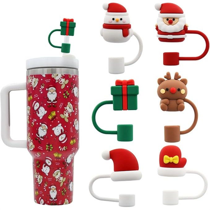 Six holiday-themed straw toppers are displayed around a decorated travel mug; designs include Santa Claus, a reindeer, a gift box, and festive hats.