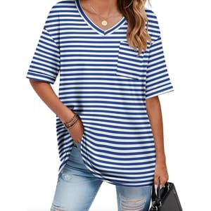 A woman is wearing a blue and white striped short-sleeve V-neck shirt with a pocket and light blue ripped jeans, carrying a black handbag. She has on bracelets and a necklace with a round pendant.
