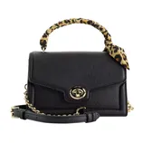 Black handbag with a leopard-patterned handle wrap, featuring a gold-tone turn-lock closure and a detachable chain strap.