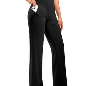 Black high-waisted yoga pants with wide legs, featuring a side pocket holding a smartphone.