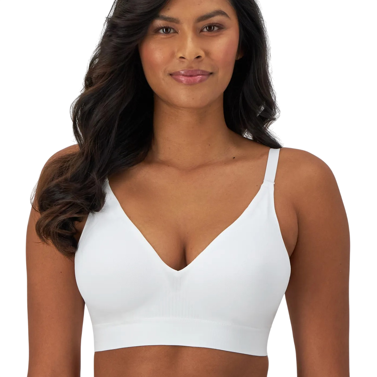 A woman is wearing a white wireless bra with thin straps and a V-neck design.