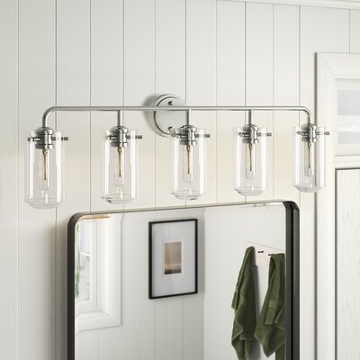A four-bulb vanity light fixture with clear glass shades and a chrome finish, mounted above a bathroom mirror.