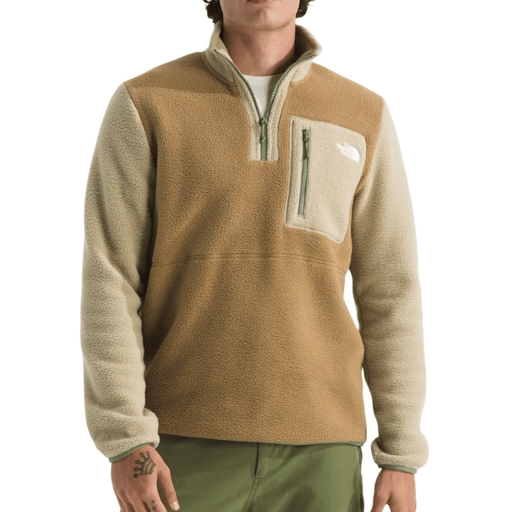 A two-toned brown and beige fleece pullover with a half-zip, featuring a zippered chest pocket and logo.