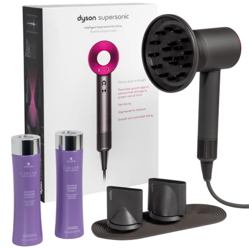 Dyson Supersonic hair dryer with attachments, accompanied by Alterna Caviar shampoo and conditioner.