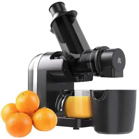 Electric juicer with a sleek black design, next to a few oranges, pouring juice into a transparent container.