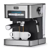 A stainless steel TRU espresso machine with 15-bar pressure, a steam wand, and digital controls, dispensing coffee into two small cups.
