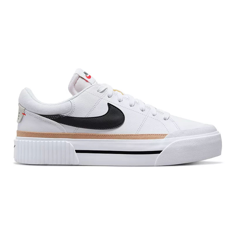 Nike Legacy Lift Shoes feature a white upper with a black Swoosh, a ribbed platform midsole, and tan accents. They have a lace-up closure, providing a modern and stylish look.