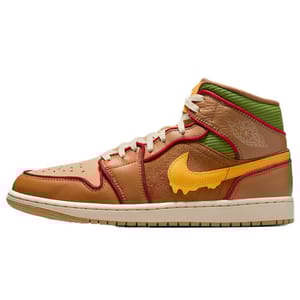 A multicolored Air Jordan sneaker with a unique design, featuring tan, red, green, and a yellow drip-effect Swoosh.