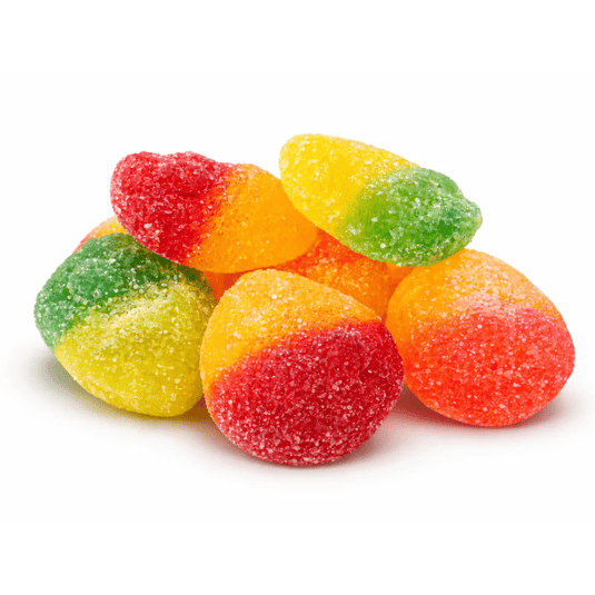 A pile of sugar-coated, multicolored gummy candies in red, yellow, orange, and green.