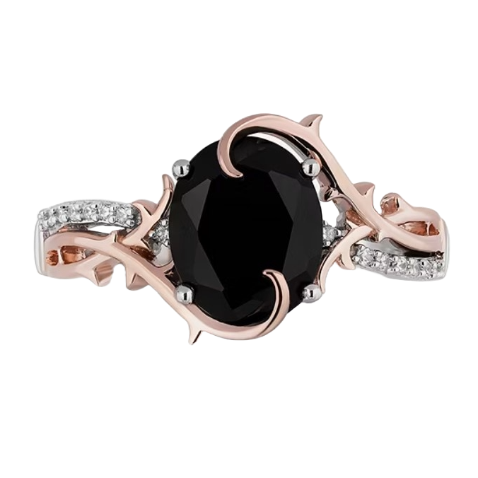 This is a rose gold ring with a large black gemstone in the center, surrounded by clear gem accents and thorn-like embellishments suggesting a Disney Villain theme.