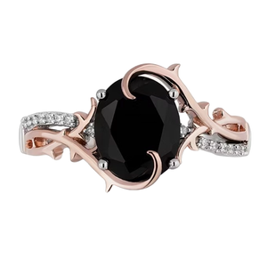 This is a rose gold ring with a large black gemstone in the center, surrounded by clear gem accents and thorn-like embellishments suggesting a Disney Villain theme.