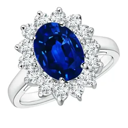 A white gold ring featuring a large oval blue sapphire surrounded by a halo of round white diamonds.