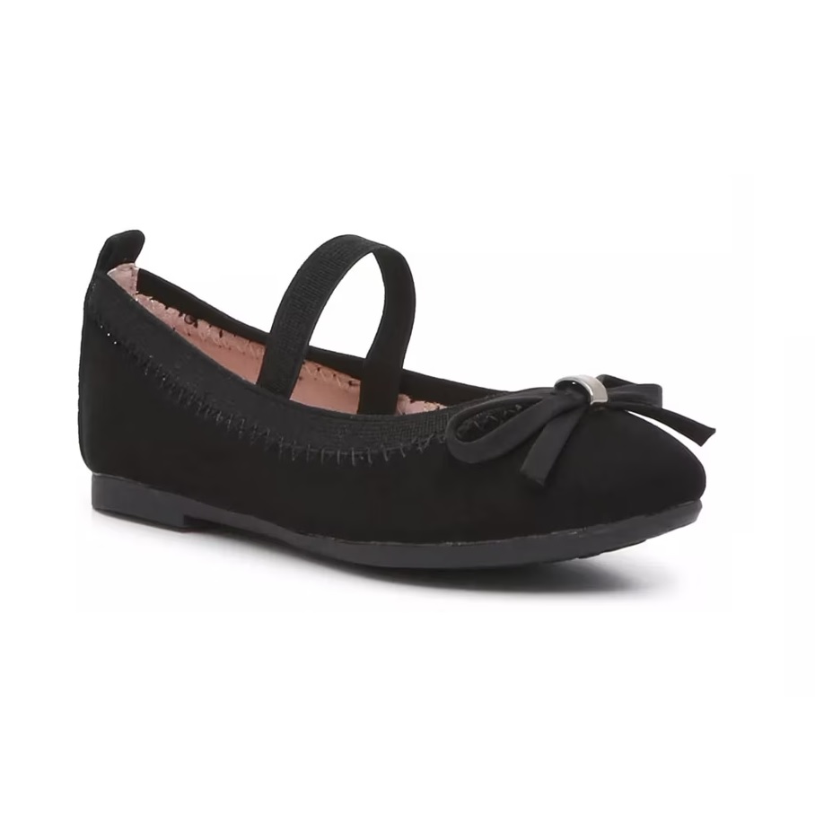 A black ballet flat featuring a bow on the toe and an elastic strap across the top for added support.