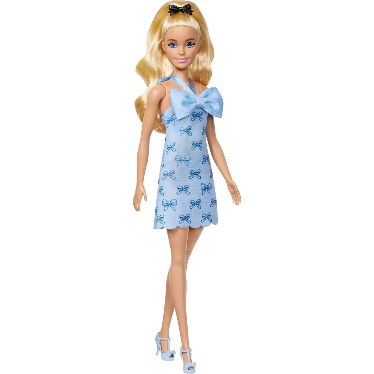 A doll with long blonde hair, wearing a light blue dress adorned with blue bow patterns, featuring a large bow at the neckline, complemented by light blue high-heeled shoes.