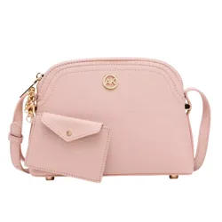 A blush pink crossbody bag with a textured finish, gold-tone hardware, and a small matching cardholder attached.
