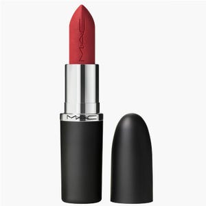A MAC brand lipstick with a red shade, with its cap placed beside it.