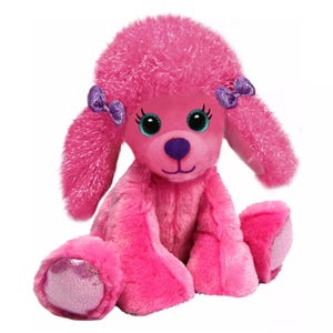 A plush pink poodle toy with fluffy ears, glittery purple bows, and sparkling paw pads. It features large green eyes and a friendly expression.
