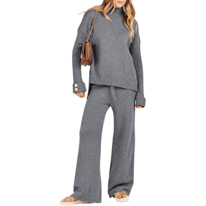 A person is wearing a gray knit sweater with ribbed cuffs and a matching pair of wide-leg pants, accessorized with a brown shoulder bag and beige sandals.