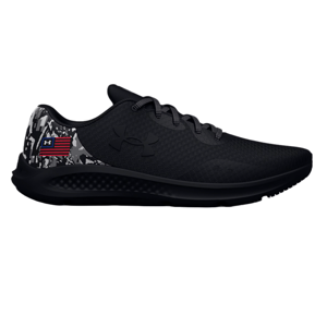 Black Under Armour running shoe with a subtle textured design, featuring a black logo, gray camo accents on the heel, and an American flag-inspired emblem.