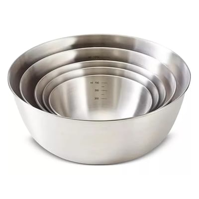 A set of stainless steel mixing bowls in different sizes, each with volume markings on the inside for measurement.