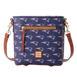 A navy blue crossbody bag featuring a pattern of a sports team logo with brown leather strap and accents, a front zipper pocket, and a Dooney & Bourke label.