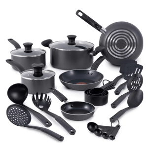 18-piece T-Fal nonstick cookware set includes various pots and pans with lids, a frying pan, a saucepan, a small egg pan, slotted and solid spoons, spatulas, ladles, pasta server, measuring cups, and spoons, all in black with nonstick surfaces and ergonomic handles.