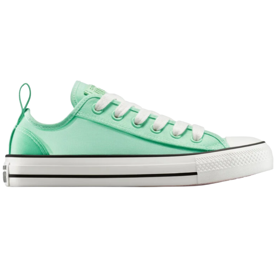 A mint green low-top sneaker with white laces, toe cap, and sole, featuring black trim lines and a heel loop.