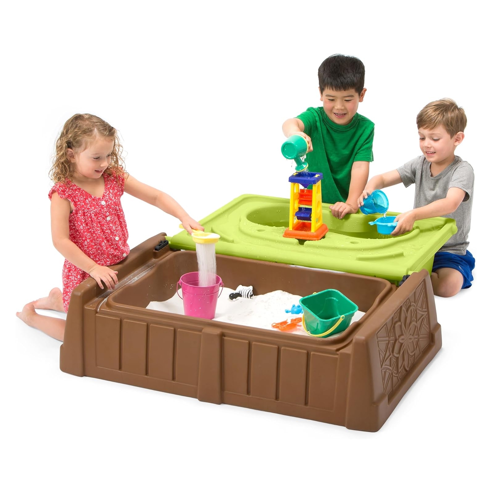 Kids' play table with a dual-section design featuring a green water compartment and a brown sandpit. Includes colorful accessories like buckets and water wheels. Three children are engaged in play, using the compartments for sand and water activities.
