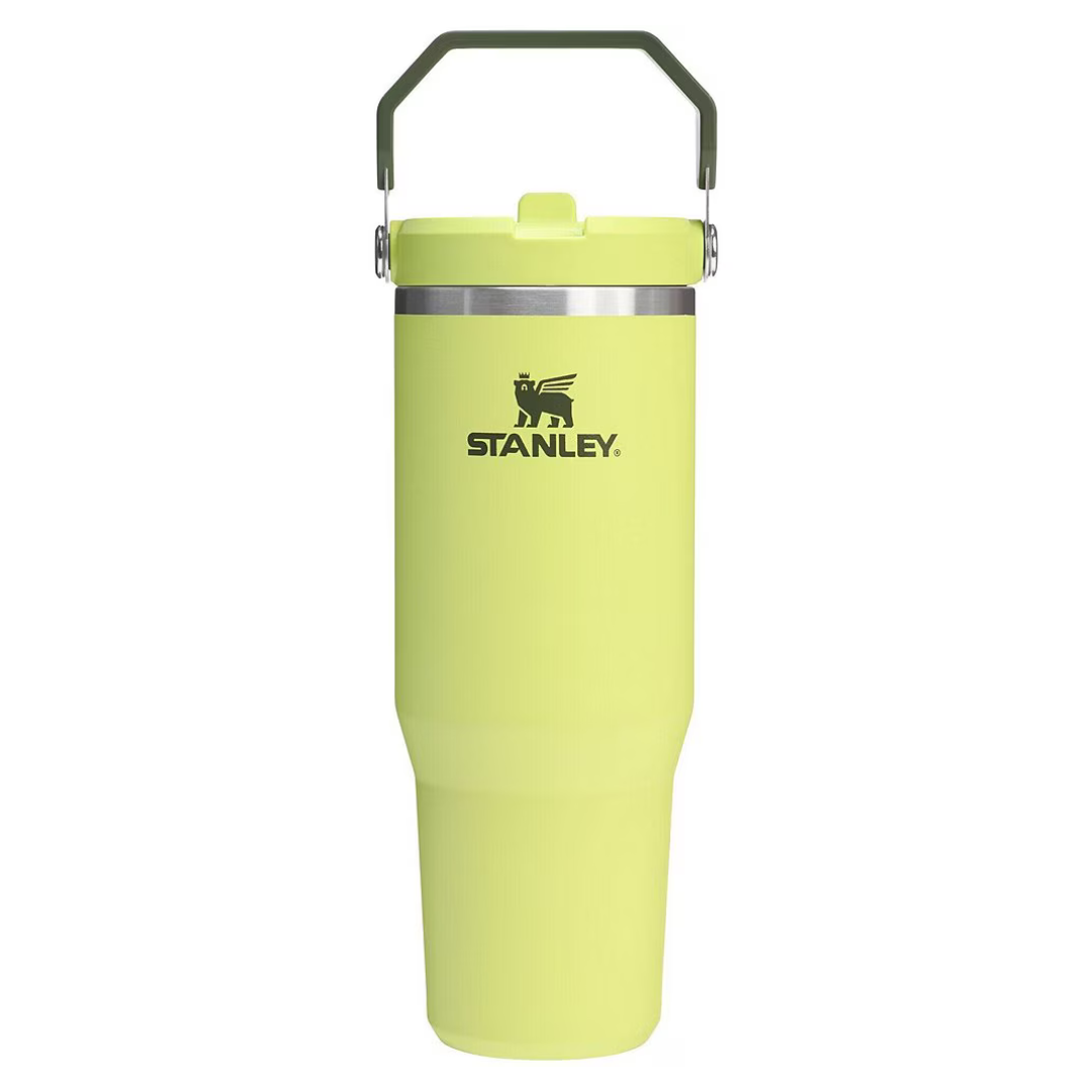 A bright yellow Stanley travel mug with a sturdy handle and secure lid, ideal for keeping beverages hot or cold on the go.